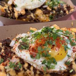 Beef fries with an egg