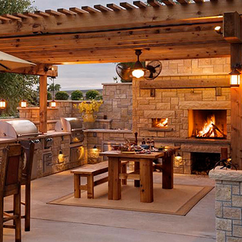 Paradise Fencing - an outdoor kitchen with a fireplace - General Contractors Near Me Paradise Fencing - an outdoor kitchen with a fireplace - General Contractors Near Me