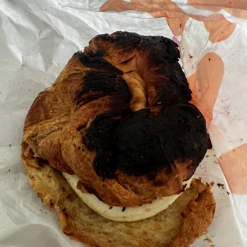 Dunkin' - Burnt bacon, egg, and cheese croissant. - Coffee & Tea Near Me - Ellenton, Florida