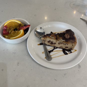 Pita Jungle - Turtle Cheesecake and fruit cup - Mediterranean Near Me - Phoenix, Arizona Pita Jungle - Turtle Cheesecake and fruit cup - Mediterranean Near Me - Phoenix, Arizona