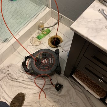 Drain-Rite Rooter - Using a sewer camera to inspect a plumbing drain under the house to see what keeps causing clogs and backups. - Plumbing Near Me