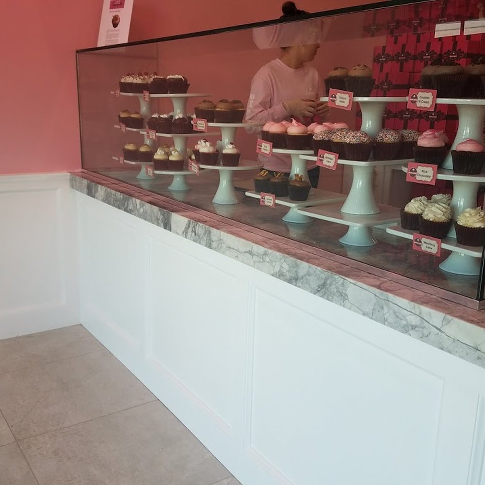 Smallcakes - A different angle of the display case to see the cupcakes that the store offers - Cupcakes Near Me - Western Springs, Illinois Smallcakes - A different angle of the display case to see the cupcakes that the store offers - Cupcakes Near Me - Western Springs, Illinois