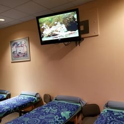 Massage By Ping's Place - Our wall tv runs a sequence of underwater videos that highlights many different sea fish from a high to low range.