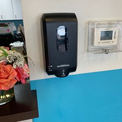 Akos Urgent Care - An empty sanitizer dispenser and that's all in the building like that
