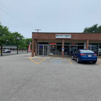 The Coffee Post - a blue car parked in a parking lot - Coffee & Tea Near Me - Chesterland, Ohio