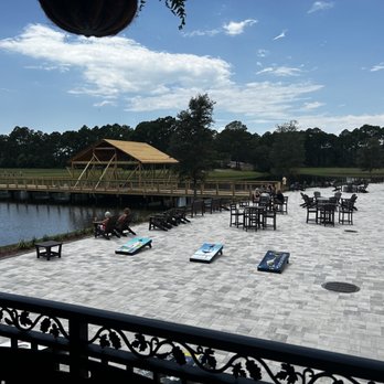Duplin Winery - a view of a patio with lounge chairs and a gazebo - Wine Tours Near Me - Panama City Beach, Florida Duplin Winery - a view of a patio with lounge chairs and a gazebo - Wine Tours Near Me - Panama City Beach, Florida
