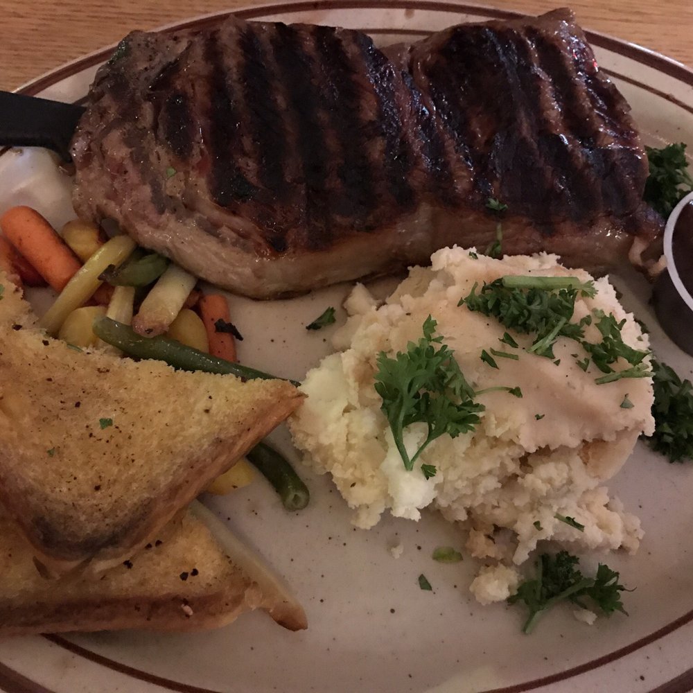 Bubba’s Roadhouse - Steak with potatoes and garlic bread - American Near Me - Sultan, Washington Bubba’s Roadhouse - Steak with potatoes and garlic bread - American Near Me - Sultan, Washington
