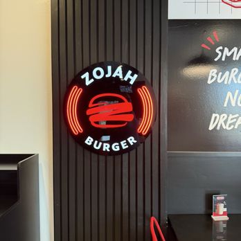 ZOJAH Burger - Sign leading to the hallway with the bathroom. - Burgers Near Me - San Antonio, Texas ZOJAH Burger - Sign leading to the hallway with the bathroom. - Burgers Near Me - San Antonio, Texas