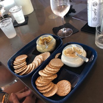 Hi-Fi Rooftop Bar - Hummus and crackers (left) and Roasted Garlic and Herb spread - Cocktail Bars Near Me - Dunedin, Florida Hi-Fi Rooftop Bar - Hummus and crackers (left) and Roasted Garlic and Herb spread - Cocktail Bars Near Me - Dunedin, Florida