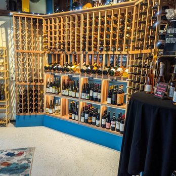 The Beatrice - a wine cellar with many bottles of wine - Wine Bars Near Me - Medford, Oregon