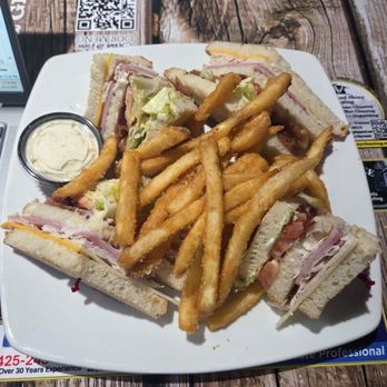 Hawkeyes Tavern - Club sandwich with crispy fries. - American Near Me - Lake Stevens, Washington Hawkeyes Tavern - Club sandwich with crispy fries. - American Near Me - Lake Stevens, Washington