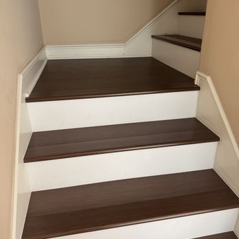 Newhome Design Studio - stairs with new flooring with white risers. - Cabinetry Near Me - Santa Fe Springs, California Newhome Design Studio - stairs with new flooring with white risers. - Cabinetry Near Me - Santa Fe Springs, California
