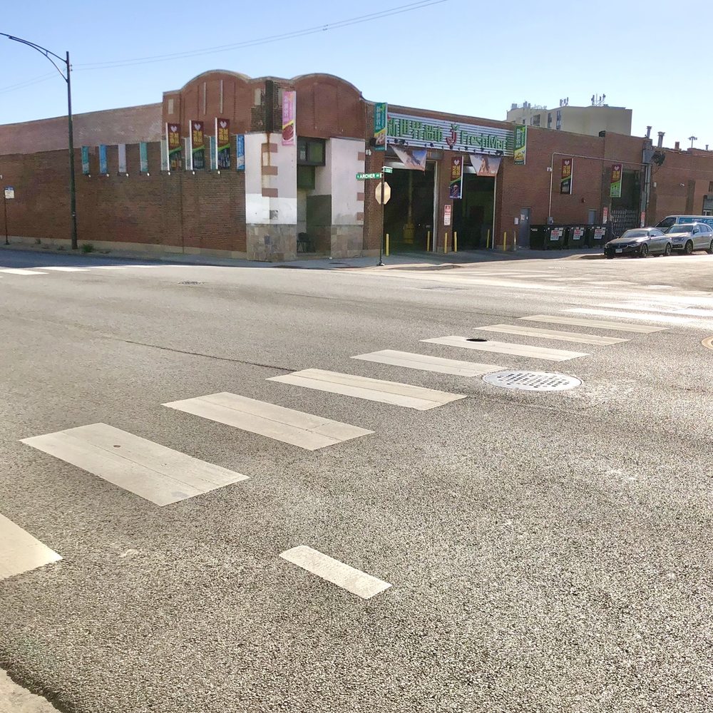 J Freshmart - Main entrance, looking from the bus stop. BEWARE  OF THE OPEN HOLE IN THE CROSSWALK. - Grocery Near Me - Chicago, Illinois