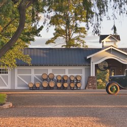 Inn At Abeja - A signature arrival at Abeja, where the Carriage House, wine barrels and vintage farm truck welcome guests to the estate.