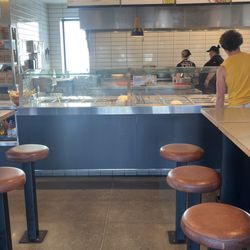 In a line of 21 people and there is no one even on the line since the one person serving is also the only cashier. Clown show management!