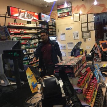 Chevron - a man standing at a cash register - Gas Stations Near Me - Sacramento, California