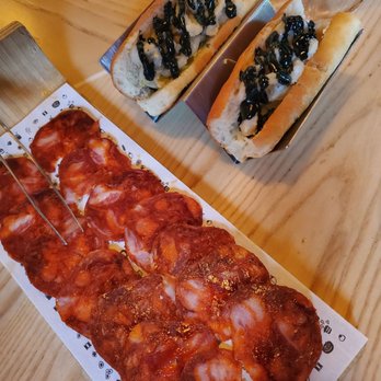 Madrina Bar y Tapas - CHORIZO IBÉRICO DE BELLOTA y BOCATA DE CALAMARES - Tapas Bars Near Me - Toronto, Ontario Madrina Bar y Tapas - CHORIZO IBÉRICO DE BELLOTA y BOCATA DE CALAMARES - Tapas Bars Near Me - Toronto, Ontario