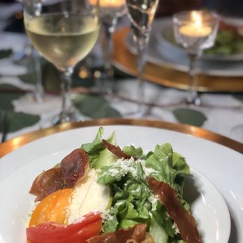 Chef Abyssinia - First course: salad with tomatoes, fresh figs, pears, prosciutto, parmesan cheese in a honey lemon vinaigrette paired with chardonnay - Caterers Near Me