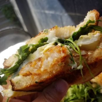 Uncle Eddie's - Bite out of the breakfast sandwich ( egg, cheese and hashbrowns) - Sandwiches Near Me - Seattle, Washington Uncle Eddie's - Bite out of the breakfast sandwich ( egg, cheese and hashbrowns) - Sandwiches Near Me - Seattle, Washington