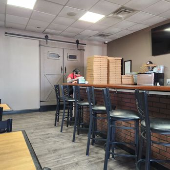 Old School NY Pizza - Person on speaker in the bar. - Pizza Near Me - Louisville, Kentucky Old School NY Pizza - Person on speaker in the bar. - Pizza Near Me - Louisville, Kentucky