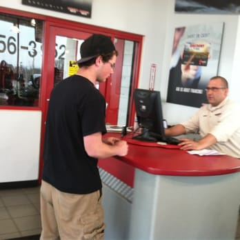 Discount Tire - Manager working with a customer on new tires. - Tires Near Me - Merrillville, Indiana Discount Tire - Manager working with a customer on new tires. - Tires Near Me - Merrillville, Indiana
