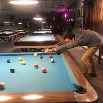 Hippodrome Billiards - a man playing pool - Pool Halls Near Me - Buffalo, New York Hippodrome Billiards - a man playing pool - Pool Halls Near Me - Buffalo, New York