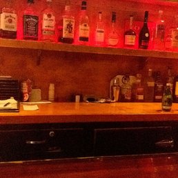 a bar with a television on the wall