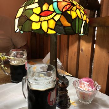 German Cafe - a glass of beer and a lamp on a table - German Near Me - French Lick, Indiana German Cafe - a glass of beer and a lamp on a table - German Near Me - French Lick, Indiana