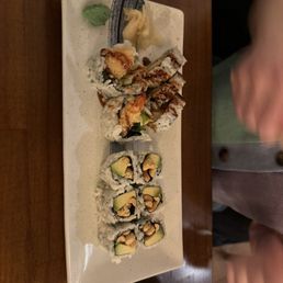 a plate of sushi with chopsticks a plate of sushi with chopsticks