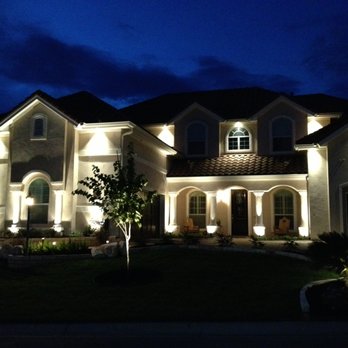 CDR Irrigation & Landscapes - a home at night - Tree Services Near Me CDR Irrigation & Landscapes - a home at night - Tree Services Near Me