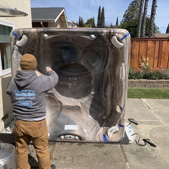 Sensible Spas - Giving the spa a final wash down prior to install and fill - Hot Tub & Pool Near Me - Livermore, California Sensible Spas - Giving the spa a final wash down prior to install and fill - Hot Tub & Pool Near Me - Livermore, California