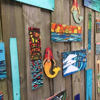 Nalu's - Colorful art behind the picnic tables - Food Stands Near Me - St. Augustine, Florida