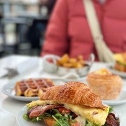 Farine Bakery & Cafe - The breakfast sandwich, liege waffle (left), crème brûlée cronut (right), and side order of potatoes (very back middle)