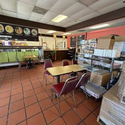 Pallets of supplies all over the inside of the restaurant.