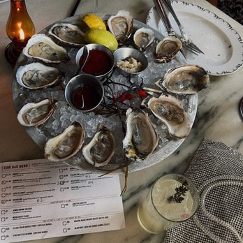 Loch Bar - oysters with secret garden cocktail and mimosa - Seafood Near Me - Houston, Texas