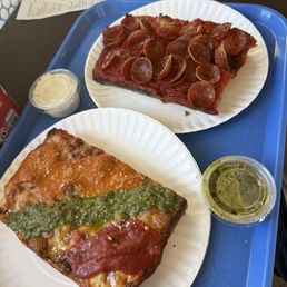 Zio trio square (Marina, pesto, vodka sauce). Pepperoni square. Side of secret green sauce (a medium spicy sauce great for pizza)