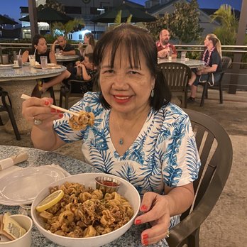 Nico's Pier 38 - Enjoying calamari - Seafood Near Me - Honolulu, Hawaii Nico's Pier 38 - Enjoying calamari - Seafood Near Me - Honolulu, Hawaii
