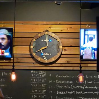 Bainbridge Brewing Alehouse - The ferry clock, which hangs above the bar, and tells you when the next ferry is due (and how far along the last one is). - Beer Bar Near Me - Bainbridge Island, Washington