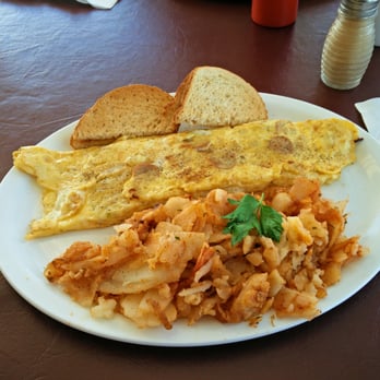 Airpark Cafe - an omelet with a side of sauerkraut and bread - Breakfast & Brunch Near Me - Guelph, Ontario