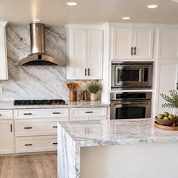 Pacific Kitchens Inc - Refaced by Pacific Kitchens with Satin White Bevel Shaker doors in Thermofoil.