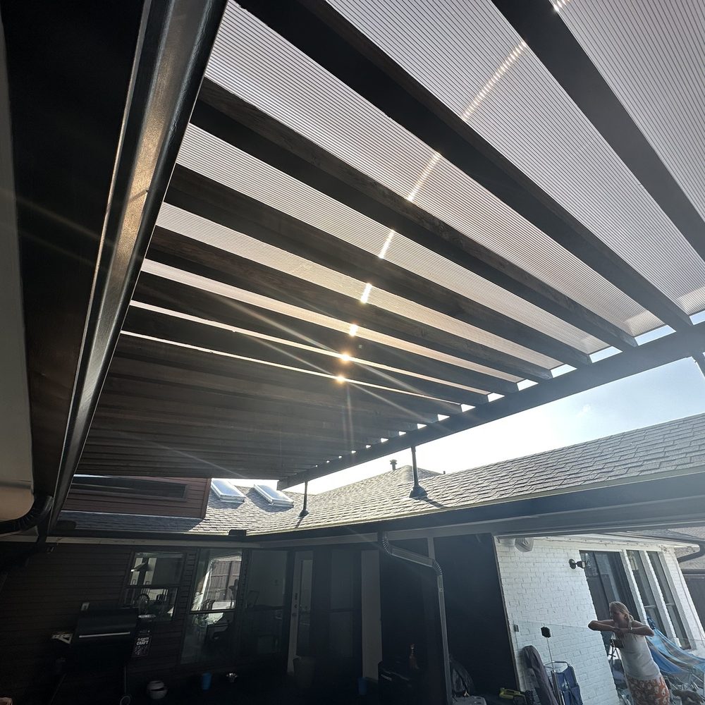 Reformed Outdoor Structures - Courtyard pergola with skyjacks and bronze poly carbonate - Patio Coverings Near Me - Dallas, Texas