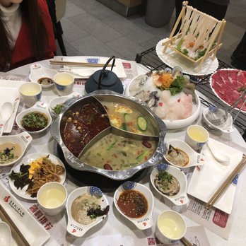 Liuyishou Hotpot - Soup base with a table full of food - Hot Pot Near Me - Flushing, New York