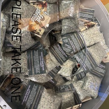 Money Museum - A bin filled with shredded currency, accompanied by informational cards and promotional flyers about money and FedShreds. - Museums Near Me - Chicago, Illinois