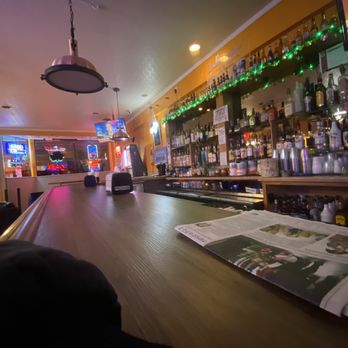 PatiO's Irish Pub - a bar with a newspaper on the counter - Irish Pub Near Me - Dixon, Illinois PatiO's Irish Pub - a bar with a newspaper on the counter - Irish Pub Near Me - Dixon, Illinois