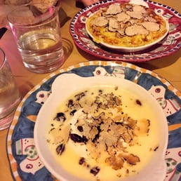 Warmed goat cheese with blueberries and truffles, and omelette with artichokes and truffles Warmed goat cheese with blueberries and truffles, and omelette with artichokes and truffles