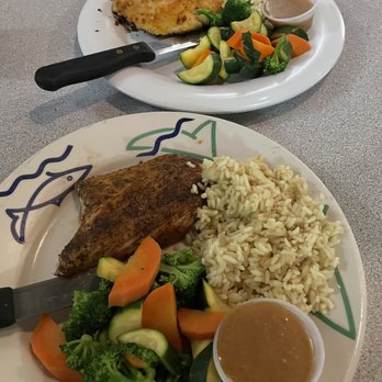 The Lobster Trap - Mac crusted sea bass (above), and blackened mahi mahi (below). - Seafood Near Me - Avalon, California The Lobster Trap - Mac crusted sea bass (above), and blackened mahi mahi (below). - Seafood Near Me - Avalon, California