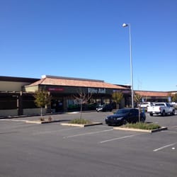 Rite Aid - The store is in the back of Popeyes that what I use for a land mark