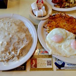 Clara's North 65 Cafe - Biscuits and gravy. Eggs, sausage, and hasbrowns.