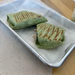 Jones Co Coffee - Spinach wrap with turkey, pesto cream cheese, onions, spinach and feta
