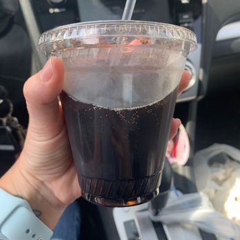 Tower Pizza & Restaurant - a hand holding a cup of soda - Pizza Near Me - Pine Plains, New York